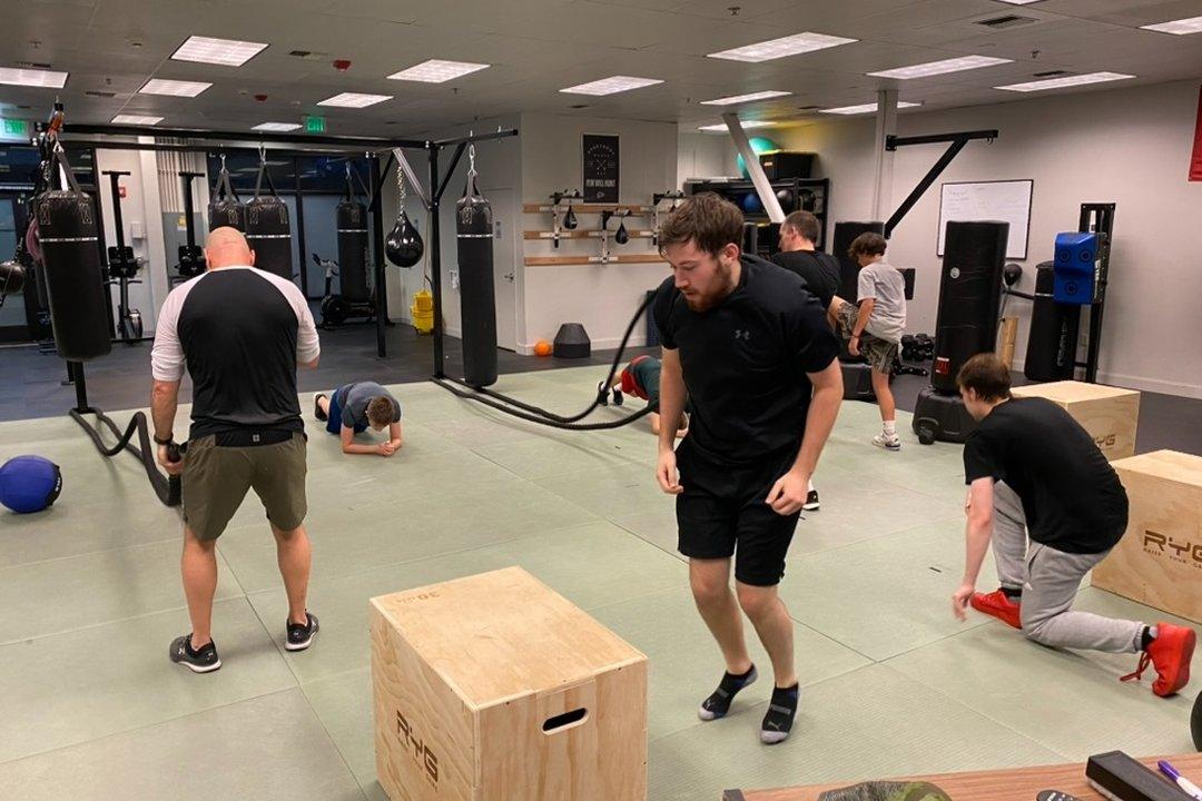 Squad training session with medicine balls and boxes
